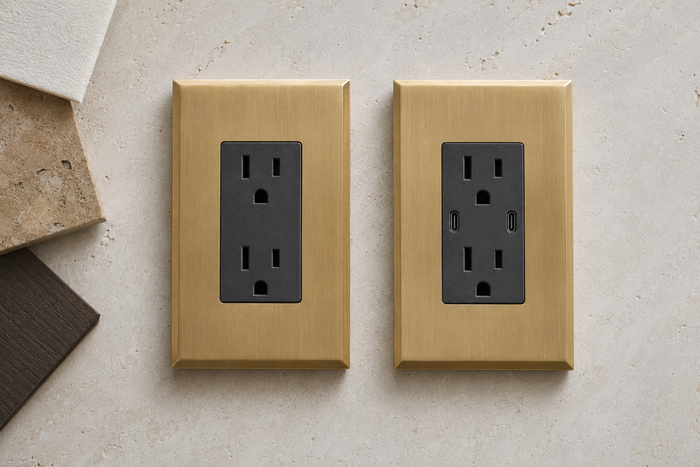 Standard duplex outlet beside a USB-C outlet in satin brass plates
