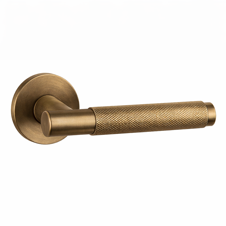 Knurled Door Handle on Round Rose - Aged Brass