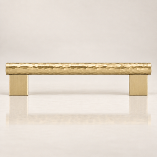 Front view of the gold-colored Bexley cabinet pull with a textured bar and rectangular mounts.
