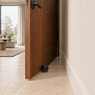Compact Floor-Mounted Door Stopper