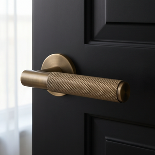 Knurled Door Handle on Round Rose - Aged Brass