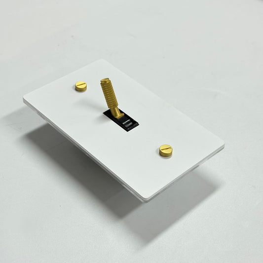 Ivory white and brass 1-gang toggle switch plate