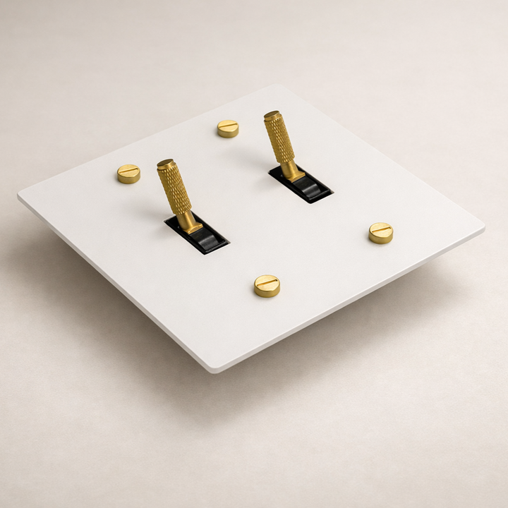 Ivory white and brass 2-gang toggle switch plate