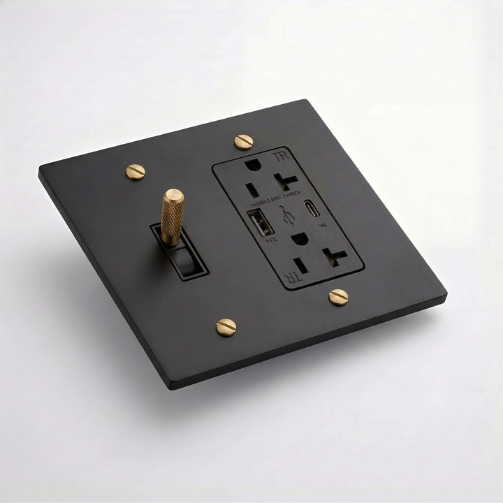 Matte Black & Brass toggle switch and USB outlet combination plate, angled view