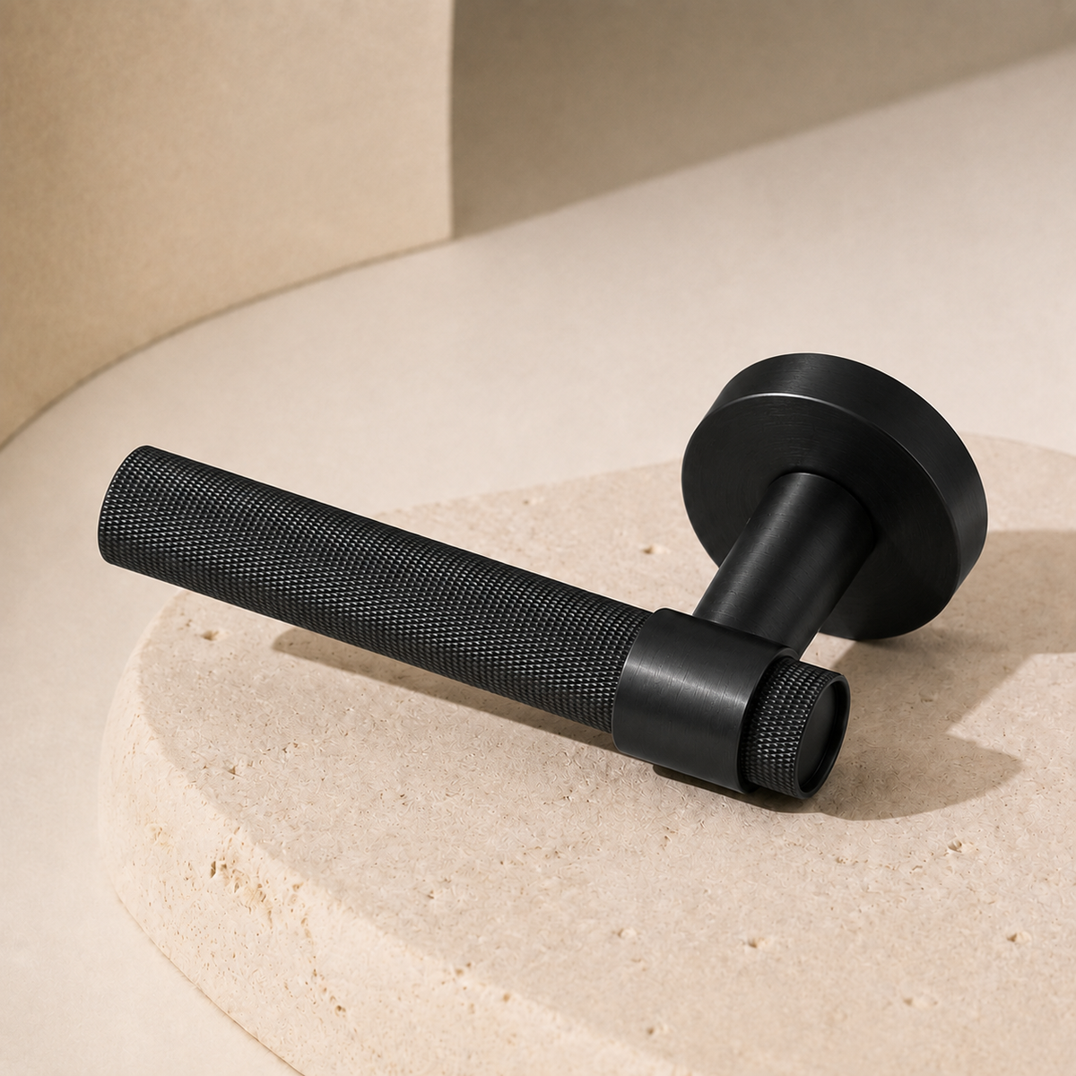 Matte Black Ellington knurled lever handle on a round display plinth