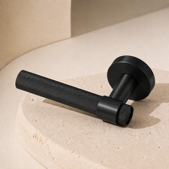 Matte Black Ellington knurled lever handle on a round display plinth